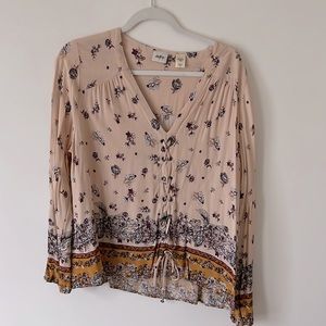 Buckle daytrip blouse with fun tie up detail in the front